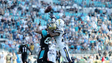 JACKSONVILLE, FL - NOVEMBER 12: Keelan Cole #84 of the Jacksonville Jaguars reaches for the football in front of Trevor Williams #24 of the Los Angeles Chargers in the second half of their game at EverBank Field on November 12, 2017 in Jacksonville, Florida. (Photo by Sam Greenwood/Getty Images)