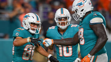 MIAMI, FL - AUGUST 25: (L-R) Danny Amendola #80, Kenny Stills #10, and Laremy Tunsil #78 of the Miami Dolphins celebrate a touchdown in the second quarter during a preseason game against the Baltimore Ravens at Hard Rock Stadium on August 25, 2018 in Miami, Florida. (Photo by Mark Brown/Getty Images)