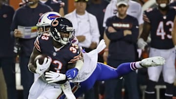 CHICAGO, IL - AUGUST 30: Taquan Mizzell #33 of the Chicago Bears gets away from Xavier Woodson-Luster #53 of the Buffalo Bills during a preseason game at Soldier Field on August 30, 2018 in Chicago, Illinois. (Photo by Jonathan Daniel/Getty Images)