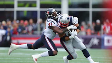 FOXBOROUGH, MA - SEPTEMBER 09: Zach Cunningham #41 of the Houston Texans tackles James Develin #46 of the New England Patriots during the first half at Gillette Stadium on September 9, 2018 in Foxborough, Massachusetts. (Photo by Maddie Meyer/Getty Images)
