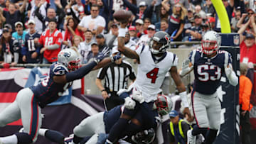 FOXBOROUGH, MA - SEPTEMBER 09: Deshaun Watson #4 of the Houston Texans throws an incomplete pass as he is pressured by the New England Patriots defense in the end zone during the first half at Gillette Stadium on September 9, 2018 in Foxborough, Massachusetts. (Photo by Jim Rogash/Getty Images)