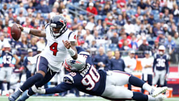 FOXBOROUGH, MA - SEPTEMBER 9: Malcom Brown #90 of the New England Patriots tackles Deshaun Watson #4 of the Houston Texans during their game on September 9, 2018 at Gillette Stadium in Foxborough, Massachusetts.(Photo by Maddie Meyer/Getty Images)