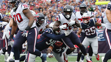 FOXBOROUGH, MA - SEPTEMBER 09: Lamar Miller #26 of the Houston Texans runs with the ball during the first half against the New England Patriots at Gillette Stadium on September 9, 2018 in Foxborough, Massachusetts. (Photo by Jim Rogash/Getty Images)