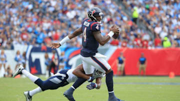 NASHVILLE, TN - SEPTEMBER 16: Deshaun Watson #4 of the Houston Texans is tackled by Wesley Woodyard #56 of the Tennessee Titans during the third quarter at Nissan Stadium on September 16, 2018 in Nashville, Tennessee. (Photo by Andy Lyons/Getty Images)