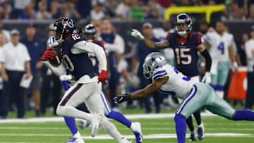 HOUSTON, TX - OCTOBER 07: DeAndre Hopkins #10 of the Houston Texans runs the ball defended by Byron Jones #31 of the Dallas Cowboys in the first quarter at NRG Stadium on October 7, 2018 in Houston, Texas. (Photo by Bob Levey/Getty Images)