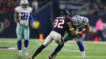 HOUSTON, TX - OCTOBER 07: Geoff Swaim #87 of the Dallas Cowboys is tackled by Tyrann Mathieu #32 of the Houston Texans in the first quarter at NRG Stadium on October 7, 2018 in Houston, Texas. (Photo by Bob Levey/Getty Images)