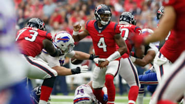HOUSTON, TX - OCTOBER 14: Kyle Williams #95 of the Buffalo Bills strips the ball from Deshaun Watson #4 of the Houston Texans in the second half at NRG Stadium on October 14, 2018 in Houston, Texas. (Photo by Tim Warner/Getty Images)