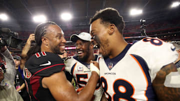 GLENDALE, AZ - OCTOBER 18: Wide receiver Demaryius Thomas #88 and linebacker Von Miller #58 of the Denver Broncos shake hands with wide receiver Larry Fitzgerald #11 of the Arizona Cardinals after the Broncos beat the Cardinals 45-10 at State Farm Stadium on October 18, 2018 in Glendale, Arizona. (Photo by Christian Petersen/Getty Images)