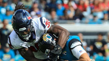 JACKSONVILLE, FL - OCTOBER 21: Cody Kessler #6 of the Jacksonville Jaguars is tackled by Jadeveon Clowney #90 of the Houston Texans during the second half at TIAA Bank Field on October 21, 2018 in Jacksonville, Florida. (Photo by Sam Greenwood/Getty Images)