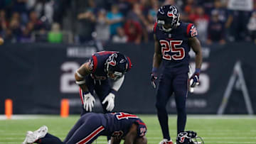 HOUSTON, TX - OCTOBER 25: Tyrann Mathieu #32 and Kareem Jackson #25 of the Houston Texans react to Johnathan Joseph's injury in the first quarter against the Miami Dolphins at NRG Stadium on October 25, 2018 in Houston, Texas. (Photo by Tim Warner/Getty Images)