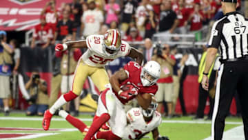 GLENDALE, AZ - OCTOBER 28: Wide receiver Christian Kirk #13 of the Arizona Cardinals scores the game winning touchdown over cornerback Jimmie Ward #20 and defensive back Tyvis Powell #30 of the San Francisco 49ers during the fourth quarter at State Farm Stadium on October 28, 2018 in Glendale, Arizona. (Photo by Christian Petersen/Getty Images)