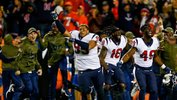 DENVER, CO - NOVEMBER 4: Defensive end Christian Covington #95, wide receiver Sammie Coates #18, and linebacker Josh Keyes #49 of the Houston Texans run onto the field to celebrate a 19-17 win over the Denver Broncos at Broncos Stadium at Mile High on November 4, 2018 in Denver, Colorado. (Photo by Justin Edmonds/Getty Images)