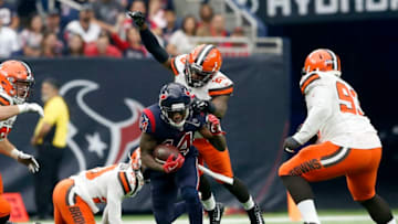 HOUSTON, TX - DECEMBER 02: Derrick Kindred #26 of the Cleveland Browns leaps to tackle DeAndre Carter #14 of the Houston Texans in the third quarter at NRG Stadium on December 2, 2018 in Houston, Texas. (Photo by Tim Warner/Getty Images)