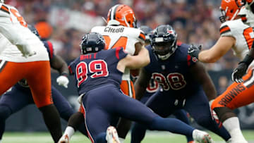 HOUSTON, TX - DECEMBER 02: Nick Chubb #24 of the Cleveland Browns is stopped for a loss by J.J. Watt #99 of the Houston Texans in the third quarter at NRG Stadium on December 2, 2018 in Houston, Texas. (Photo by Tim Warner/Getty Images)