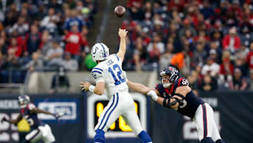 HOUSTON, TX - DECEMBER 09: Andrew Luck #12 of the Indianapolis Colts throws a pass in the second quarter under pressure by J.J. Watt #99 of the Houston Texans at NRG Stadium on December 9, 2018 in Houston, Texas. (Photo by Tim Warner/Getty Images)