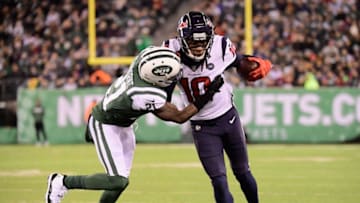 EAST RUTHERFORD, NJ - DECEMBER 15: Wide receiver DeAndre Hopkins #10 of the Houston Texans makes a first-down reception as he is taclked by cornerback Morris Claiborne #21 of the New York Jets in the first quarter at MetLife Stadium on December 15, 2018 in East Rutherford, New Jersey. (Photo by Steven Ryan/Getty Images)
