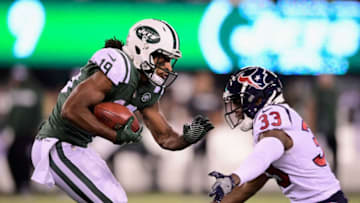 EAST RUTHERFORD, NJ - DECEMBER 15: Wide receiver Andre Roberts #19 of the New York Jets carries the ball against defensive back A.J. Moore #33 of the Houston Texans during the third quarter at MetLife Stadium on December 15, 2018 in East Rutherford, New Jersey. (Photo by Steven Ryan/Getty Images)