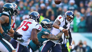 PHILADELPHIA, PA - DECEMBER 23: Defensive end Chris Long #56 of the Philadelphia Eagles forces a fumble on quarterback Deshaun Watson #4 of the Houston Texans during the fourth quarter at Lincoln Financial Field on December 23, 2018 in Philadelphia, Pennsylvania. (Photo by Mitchell Leff/Getty Images)