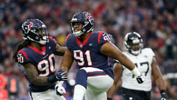 HOUSTON, TX - DECEMBER 30: Carlos Watkins #91 of the Houston Texans celebrates after a sack in the fourth quarter against the Jacksonville Jaguars at NRG Stadium on December 30, 2018 in Houston, Texas. (Photo by Tim Warner/Getty Images)