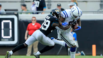 JACKSONVILLE, FLORIDA - DECEMBER 02: Tashaun Gipson #39 of the Jacksonville Jaguars tackles Eric Ebron #85 of the Indianapolis Colts during the game on December 02, 2018 in Jacksonville, Florida. (Photo by Sam Greenwood/Getty Images)
