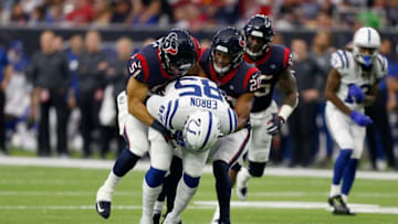 HOUSTON, TX - JANUARY 05: Eric Ebron #85 of the Indianapolis Colts catches a pass tackled by Dylan Cole #51 and Justin Reid #20 of the Houston Texans in the first quarter during the Wild Card Round at NRG Stadium on January 5, 2019 in Houston, Texas. (Photo by Bob Levey/Getty Images)