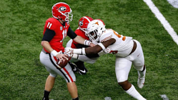 NEW ORLEANS, LOUISIANA - JANUARY 01: Charles Omenihu #90 of the Texas Longhorns pressures Jake Fromm #11 of the Georgia Bulldogs during the first half of the Allstate Sugar Bowl at the Mercedes-Benz Superdome on January 01, 2019 in New Orleans, Louisiana. (Photo by Jonathan Bachman/Getty Images)