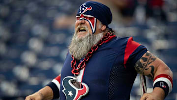 HOUSTON, TX - AUGUST 29: Fan of the Houston Texans stretches and warms up before a game against the Los Angeles Rams during week four of the preseason at NRG Stadium on August 29, 2019 in Houston, Texas. (Photo by Wesley Hitt/Getty Images)