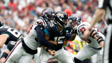 HOUSTON, TX - SEPTEMBER 15: Whitney Mercilus #59 of the Houston Texans forces Gardner Minshew #15 of the Jacksonville Jaguars to fumble the ball in the 4th quarter at NRG Stadium on September 15, 2019 in Houston, Texas. (Photo by Tim Warner/Getty Images)