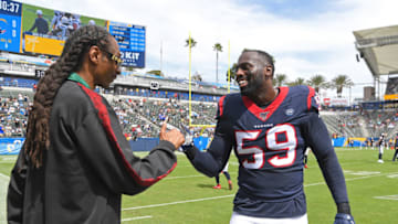 CARSON, CA - SEPTEMBER 22: Rapper Snoop Dogg talks with outside linebacker Whitney Mercilus #59 of the Houston Texans before the game against the Los Angeles Chargers at Dignity Health Sports Park on September 22, 2019 in Carson, California. (Photo by Jayne Kamin-Oncea/Getty Images)