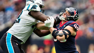 HOUSTON, TX - SEPTEMBER 29: Taylor Moton #72 of the Carolina Panthers blocks J.J .Watt #99 of the Houston Texans at NRG Stadium on September 29, 2019 in Houston, Texas. (Photo by Wesley Hitt/Getty Images)