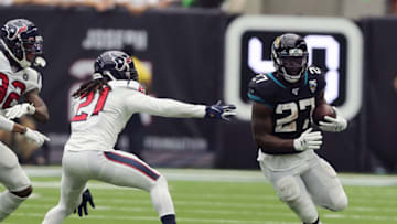 HOUSTON, TEXAS - SEPTEMBER 15: Leonard Fournette #27 of the Jacksonville Jaguars rushes past Bradley Roby #21 of the Houston Texans during the fourth quarter at NRG Stadium on September 15, 2019 in Houston, Texas. (Photo by Bob Levey/Getty Images)