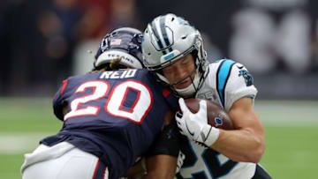 HOUSTON, TEXAS - SEPTEMBER 29: Christian McCaffrey #22 of the Carolina Panthers is hit by Justin Reid #20 of the Houston Texans during the second half at NRG Stadium on September 29, 2019 in Houston, Texas. (Photo by Bob Levey/Getty Images)
