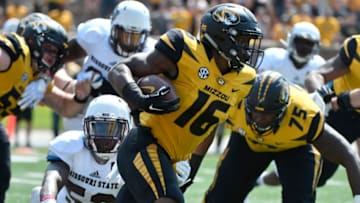 COLUMBIA, MO - SEPTEMBER 2: Running back Damarea Crockett #16 of the Missouri Tigers rushes against McNeece Egbim #52 of the Missouri State Bears in the second quarter at Memorial Stadium on September 2, 2017 in Columbia, Missouri. (Photo by Ed Zurga/Getty Images)