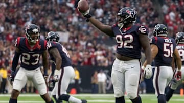 HOUSTON, TX - OCTOBER 01: Brandon Dunn #92 of the Houston Texans celebrates with Kurtis Drummond #23 after recovering a fumble in the fourth quarter against the Tennessee Titans at NRG Stadium on October 1, 2017 in Houston, Texas. (Photo by Tim Warner/Getty Images)