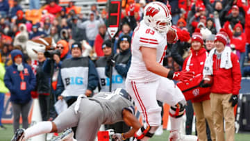 CHAMPAIGN, IL - OCTOBER 28: Michael Deiter #63 of the Wisconsin Badgers scores a touchdown during the game as Del'Shawn Phillips #3 of the Illinois Fighting Illini misses the tackle at Memorial Stadium on October 28, 2017 in Champaign, Illinois. (Photo by Michael Hickey/Getty Images)
