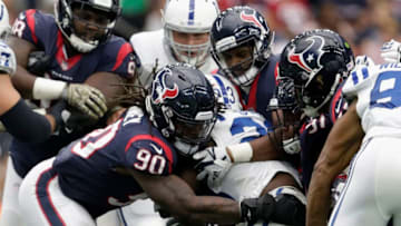HOUSTON, TX - NOVEMBER 05: Frank Gore #23 of the Indianapolis Colts is tackled by Jadeveon Clowney #90 of the Houston Texans in the second half at NRG Stadium on November 5, 2017 in Houston, Texas. (Photo by Tim Warner/Getty Images)