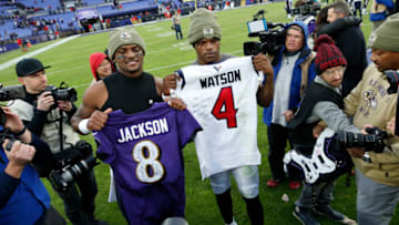 BALTIMORE, MARYLAND - NOVEMBER 17: Quarterback Lamar Jackson #8 of the Baltimore Ravens exchange jerseys with quarterback Deshaun Watson #4 of the Houston Texans after the Baltimore Ravens 41-7 win over the Houston Texans at M&T Bank Stadium on November 17, 2019 in Baltimore, Maryland. (Photo by Todd Olszewski/Getty Images)