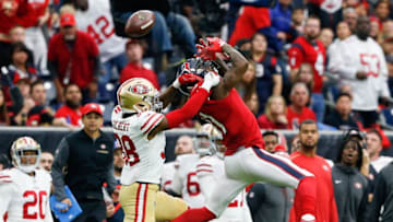 HOUSTON, TX - DECEMBER 10: DeAndrew White #11 of the Houston Texans is unable to hold on to the ball as Adrian Colbert #38 of the San Francisco 49ers defends at NRG Stadium on December 10, 2017 in Houston, Texas. (Photo by Bob Levey/Getty Images)