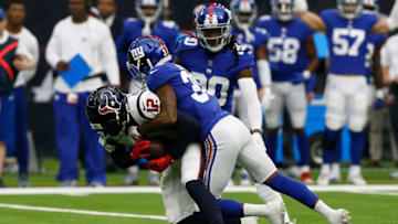 HOUSTON, TX - SEPTEMBER 23: Bruce Ellington #12 of the Houston Texans is tackled after a catch by Antonio Hamilton #30 and Janoris Jenkins #20 of the New York Giants in the first quarter at NRG Stadium on September 23, 2018 in Houston, Texas. (Photo by Bob Levey/Getty Images)