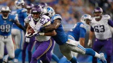 DETROIT, MI - OCTOBER 25: MyCole Pruitt #83 of the Minnesota Vikings tries to escape the tackle of Tahir Whitehead #59 of the Detroit Lions after a third quarter catch at Ford Field on October 25, 2015 in Detroit, Michigan. Minnesota won the game 28-19. (Photo by Gregory Shamus/Getty Images)