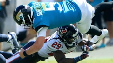 JACKSONVILLE, FL - OCTOBER 21: Blake Bortles #5 of the Jacksonville Jaguars is tackled by Andre Hal #29 of the Houston Texans during the game at TIAA Bank Field on October 21, 2018 in Jacksonville, Florida. (Photo by Sam Greenwood/Getty Images)