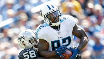 NASHVILLE, TN- SEPTEMBER 10: Tight End Delanie Walker #82 of the Tennessee Titans makes a catch defended by linebacker Tyrell Adams #58 of the Oakland Raiders in the second half at Nissan Stadium on September 10, 2017 In Nashville, Tennessee. (Photo by Wesley Hitt/Getty Images) )