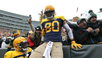GREEN BAY, WI - SEPTEMBER 30: Jimmy Graham #80 of the Green Bay Packers celebrates with fans after scoring a touchdown during the first quarter of a game against the Buffalo Bills at Lambeau Field on September 30, 2018 in Green Bay, Wisconsin. (Photo by Dylan Buell/Getty Images)