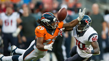 DENVER, CO - AUGUST 23: Cornerback Bradley Roby #29 of the Denver Broncos breaks up a pass intended for wide receiver Andre Johnson #80 of the Houston Texans during a preseason game at Sports Authority Field at Mile High on August 23, 2014 in Denver, Colorado. (Photo by Dustin Bradford/Getty Images)