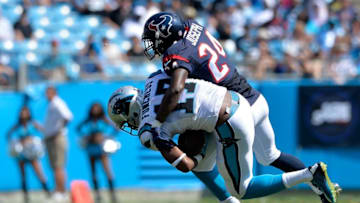 CHARLOTTE, NC - SEPTEMBER 20: Johnathan Joseph #24 of the Houston Texans tackles Devin Funchess #17 of the Carolina Panthers in the second half during their game at Bank of America Stadium on September 20, 2015 in Charlotte, North Carolina. (Photo by Grant Halverson/Getty Images)