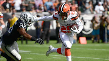 OAKLAND, CA - SEPTEMBER 30: Duke Johnson #29 of the Cleveland Browns fights off the tackle of Marquel Lee #55 of the Oakland Raiders to score on a two point conversion during the second quarter of their NFL football game at Oakland-Alameda County Coliseum on September 30, 2018 in Oakland, California. (Photo by Thearon W. Henderson/Getty Images)