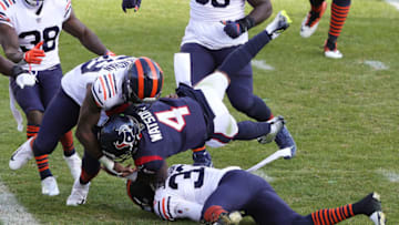 Houston Texans quarterback Deshaun Watson #4 tackled by Chicago Bears cornerback Jaylon Johnson #33 and Danny Trevathan #59 (Photo by Stacy Revere/Getty Images)