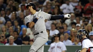 Sep 1, 2015; Boston, MA, USA; New York Yankees designated hitter Alex Rodriguez (13) hits a single during the fifth inning against the Boston Red Sox at Fenway Park. Mandatory Credit: Bob DeChiara-USA TODAY Sports
