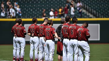 Apr 2, 2016; Phoenix, AZ, USA; Arizona Diamondbacks players look on during the national anthem before facing the Kansas City Royals at Chase Field. Mandatory Credit: Joe Camporeale-USA TODAY Sports