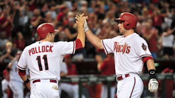 Aug 28, 2015; Phoenix, AZ, USA; Arizona Diamondbacks first baseman Paul Goldschmidt (44) celebrates with center fielder A.J. Pollock (11) after hitting a two run home run in the seventh inning against the Oakland Athletics at Chase Field. Mandatory Credit: Matt Kartozian-USA TODAY Sports